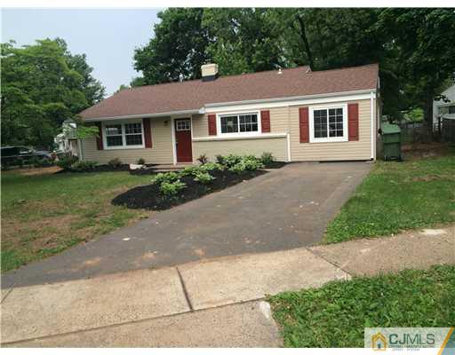21 Stony Road Edison, NJ 08817 - Photo 1 of 23 a front view of a house with a garden