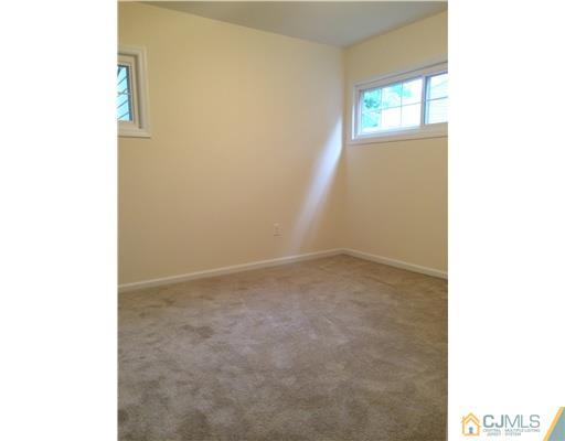 21 Stony Road Edison, NJ 08817 - Photo 15 of 23 a view of empty room with windows