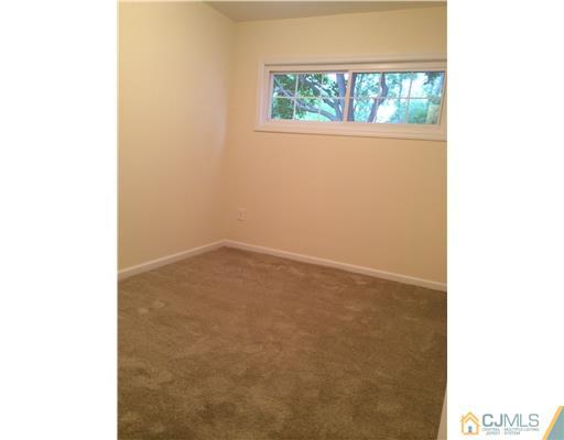 21 Stony Road Edison, NJ 08817 - Photo 16 of 23 a view of an empty room with a window