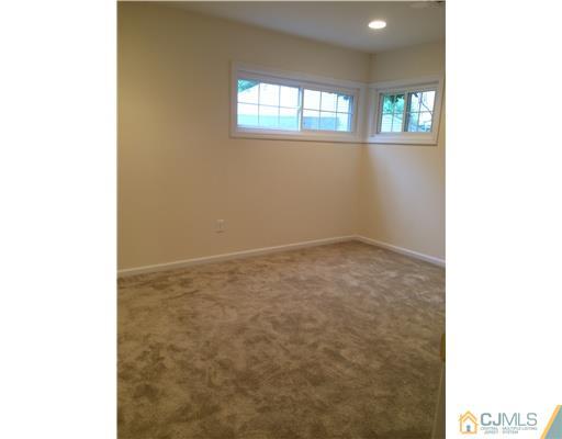 21 Stony Road Edison, NJ 08817 - Photo 18 of 23 a view of an empty room with a window