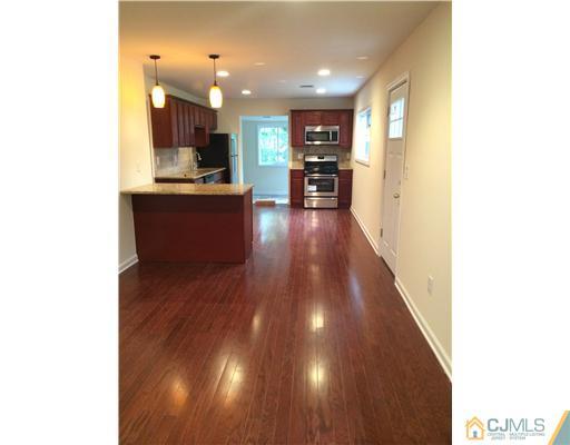 21 Stony Road Edison, NJ 08817 - Photo 5 of 23 a view of kitchen with cabinets and wooden floor