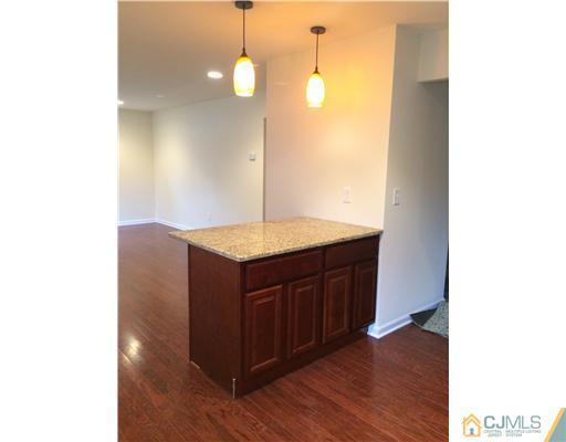 21 Stony Road Edison, NJ 08817 - Photo 7 of 23 a bathroom with a granite countertop sink and a mirror