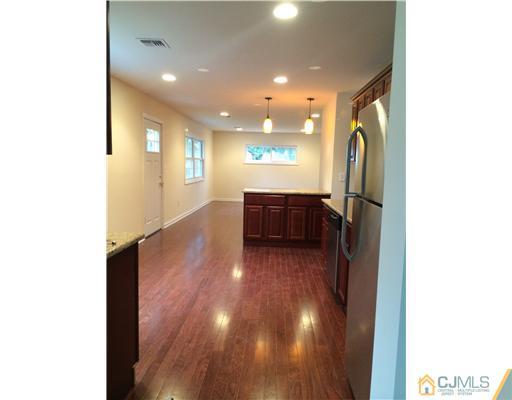 21 Stony Road Edison, NJ 08817 - Photo 10 of 23 a view of a hallway with wooden floor