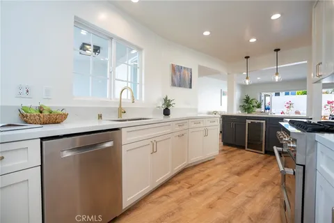 a kitchen with a sink cabinets and window