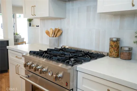 a close view of a stove a microwave and cabinets in the kitchen