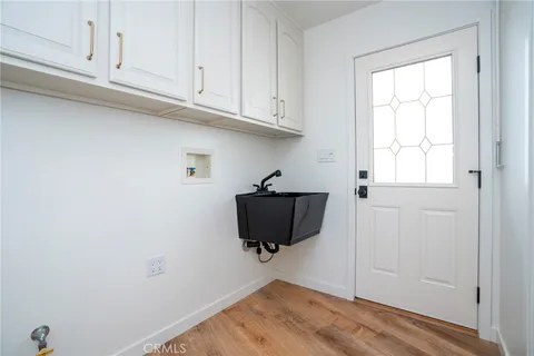 a bathroom with a sink and a window