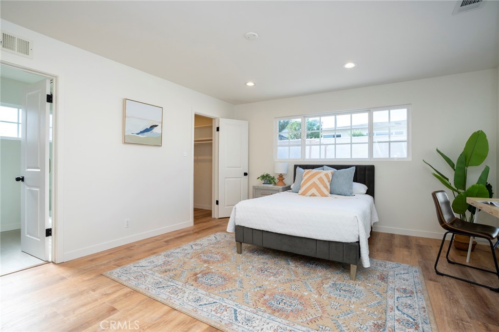 1718 West 27th Street San Pedro, CA 90732 - Photo 19 of 42 a bedroom with a bed lamp closet and window