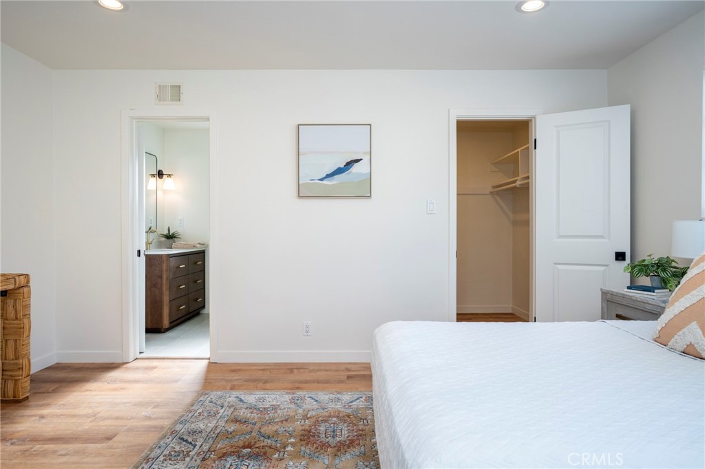 1718 West 27th Street San Pedro, CA 90732 - Photo 20 of 42 a bedroom with a bed and a view of bathroom