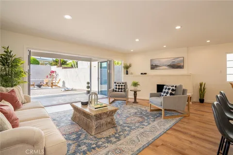 a living room with furniture large window and outer view