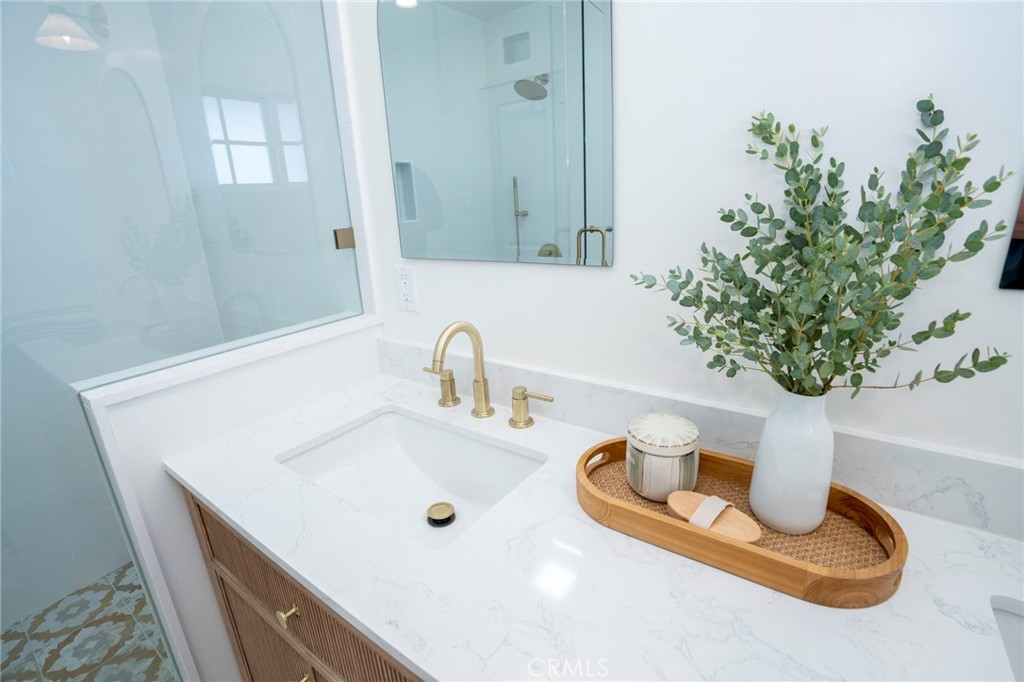 1718 West 27th Street San Pedro, CA 90732 - Photo 23 of 42 a bathroom with a sink a toilet and mirror
