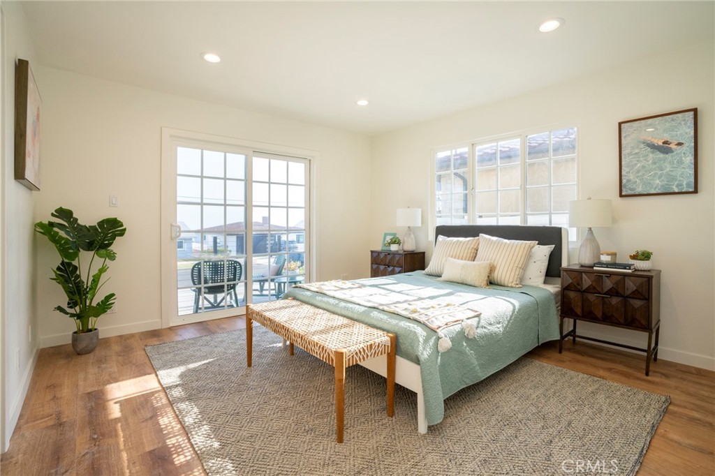 1718 West 27th Street San Pedro, CA 90732 - Photo 25 of 42 a bedroom with a bed and a couch