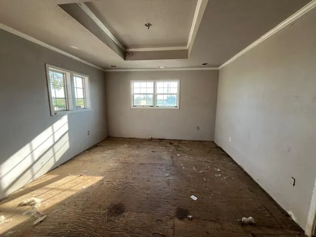 a view of an empty room with windows