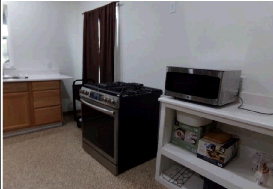 3349 Fm 2652 Graham, TX 76450 - Photo 5 of 12 a kitchen with a stove and a microwave