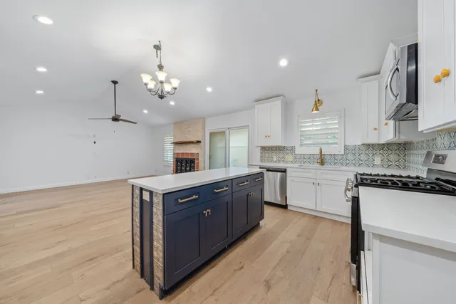 a kitchen with wooden cabinets and sink