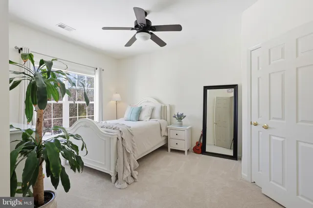 a bedroom with furniture and window