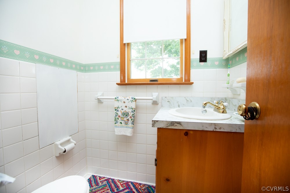 2763 Lockett Road Rice, VA 23966 - Photo 17 of 49 a bathroom with a sink a toilet and shower curtain