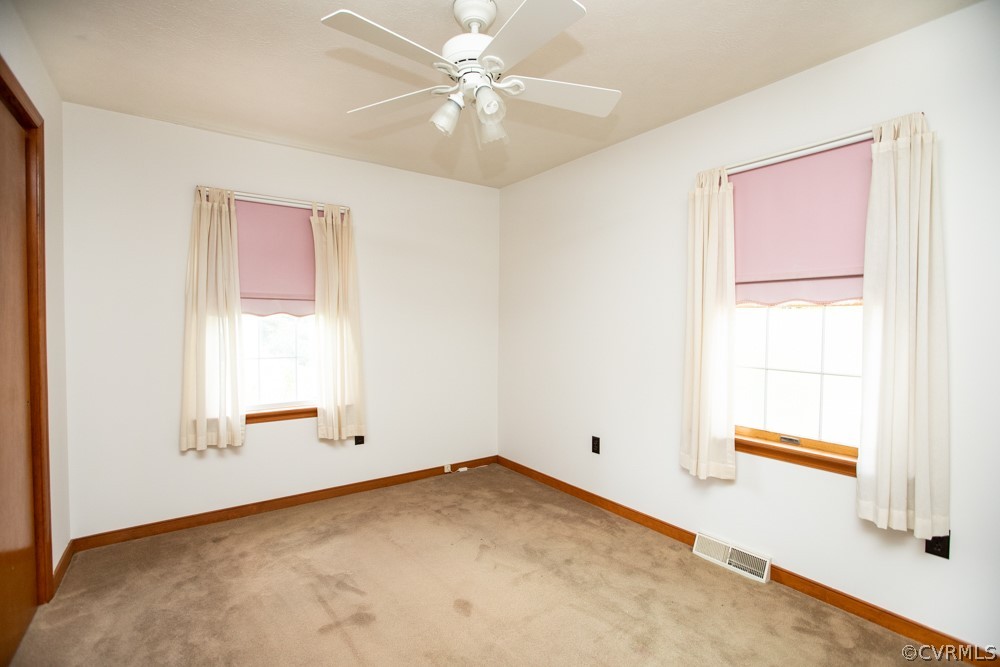 2763 Lockett Road Rice, VA 23966 - Photo 18 of 49 an empty room with a window and a ceiling fan