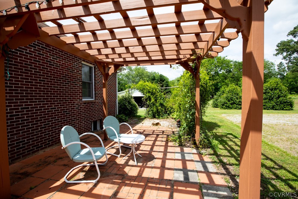 2763 Lockett Road Rice, VA 23966 - Photo 5 of 49 a backyard of a house with table and chairs
