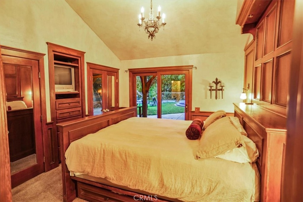 25326 Avenida Cappela Valencia, CA 91355 - Photo 11 of 48 a bedroom with a bed and window