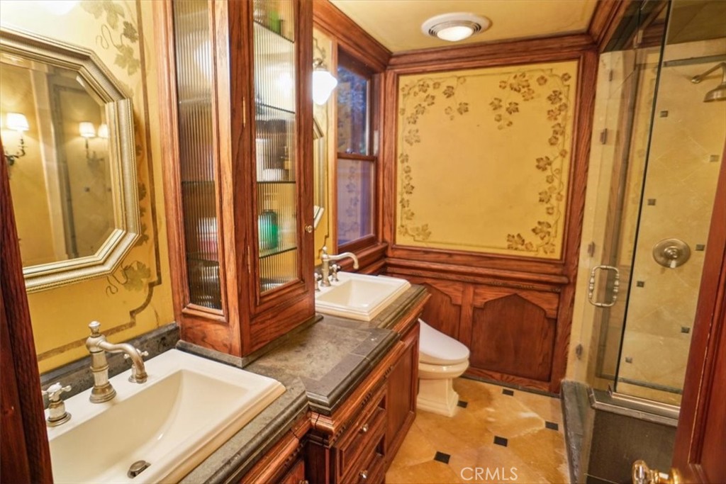 25326 Avenida Cappela Valencia, CA 91355 - Photo 13 of 48 a bathroom with a granite countertop sink toilet and shower