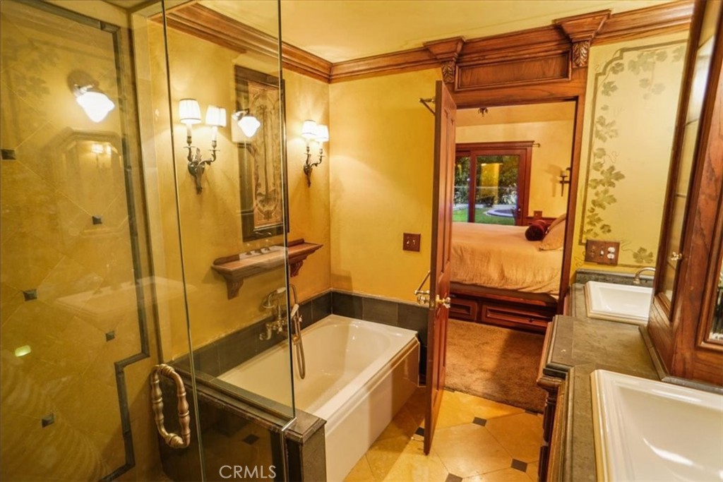 25326 Avenida Cappela Valencia, CA 91355 - Photo 14 of 48 a bathroom with a shower and a sink