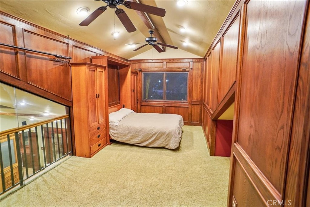 25326 Avenida Cappela Valencia, CA 91355 - Photo 21 of 48 a bedroom with a bed and a chandelier