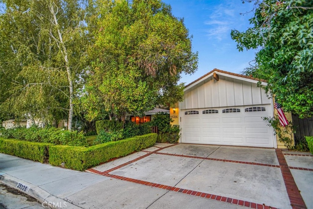 25326 Avenida Cappela Valencia, CA 91355 - Photo 32 of 48 a view of house with backyard and garden