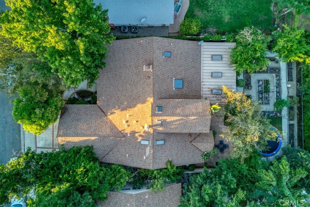 25326 Avenida Cappela Valencia, CA 91355 - Photo 34 of 48 an aerial view of a house with yard and swimming pool