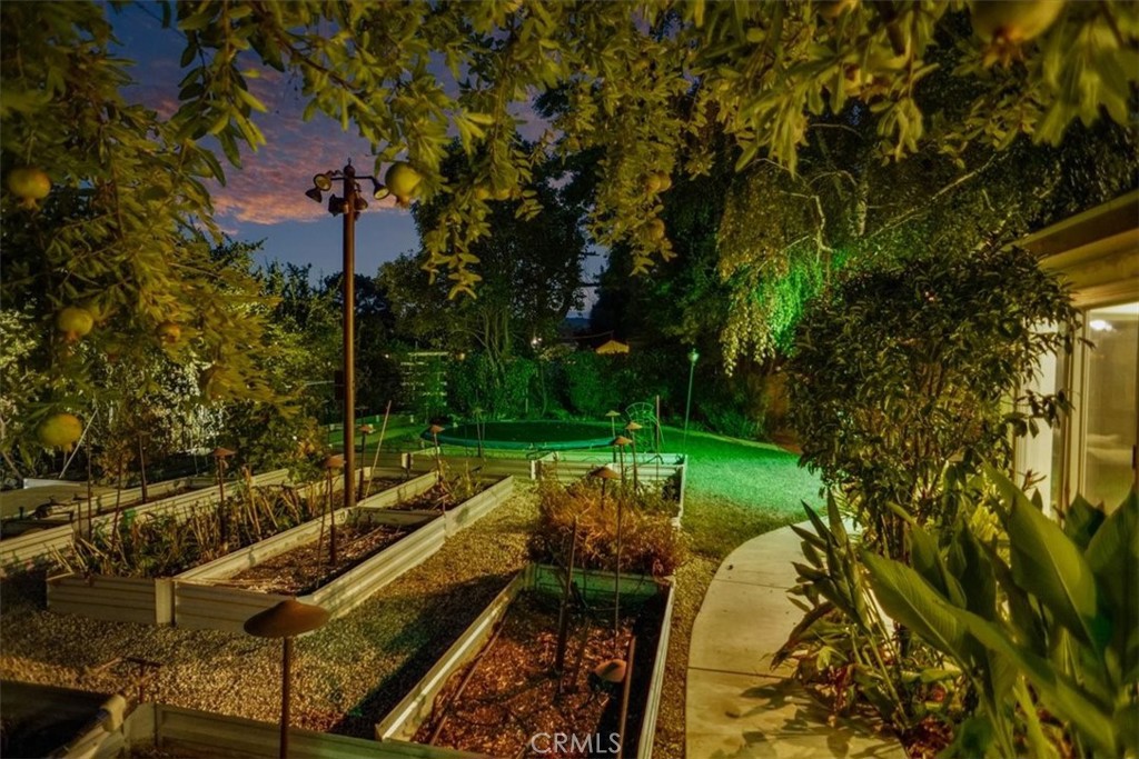 25326 Avenida Cappela Valencia, CA 91355 - Photo 41 of 48 a view of swimming pool with a garden and trees
