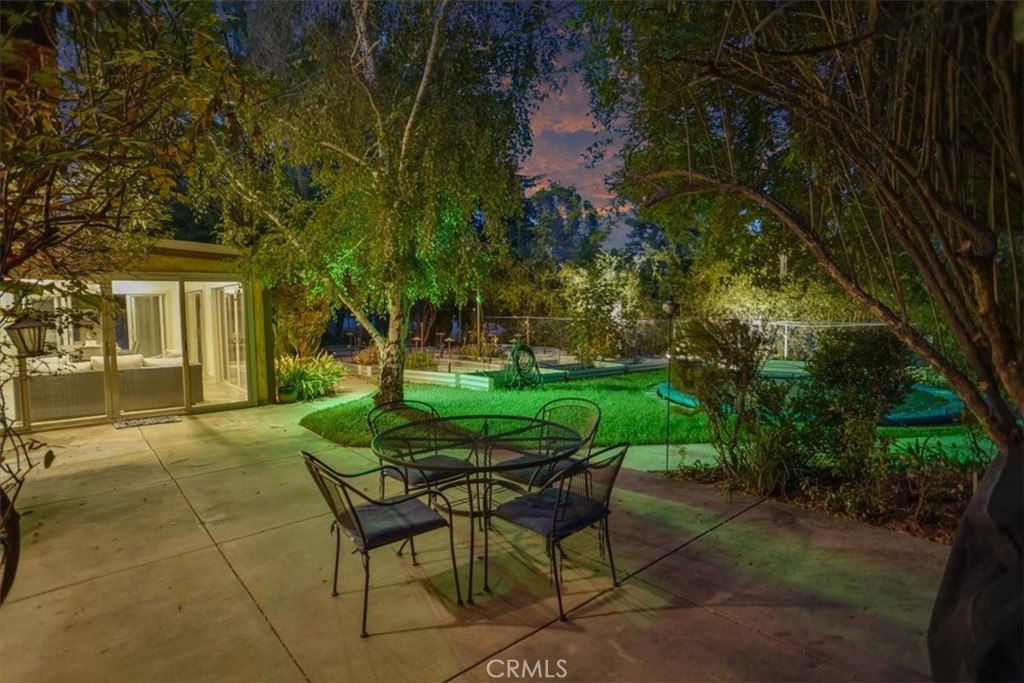 25326 Avenida Cappela Valencia, CA 91355 - Photo 42 of 48 a view of a chairs and table in backyard