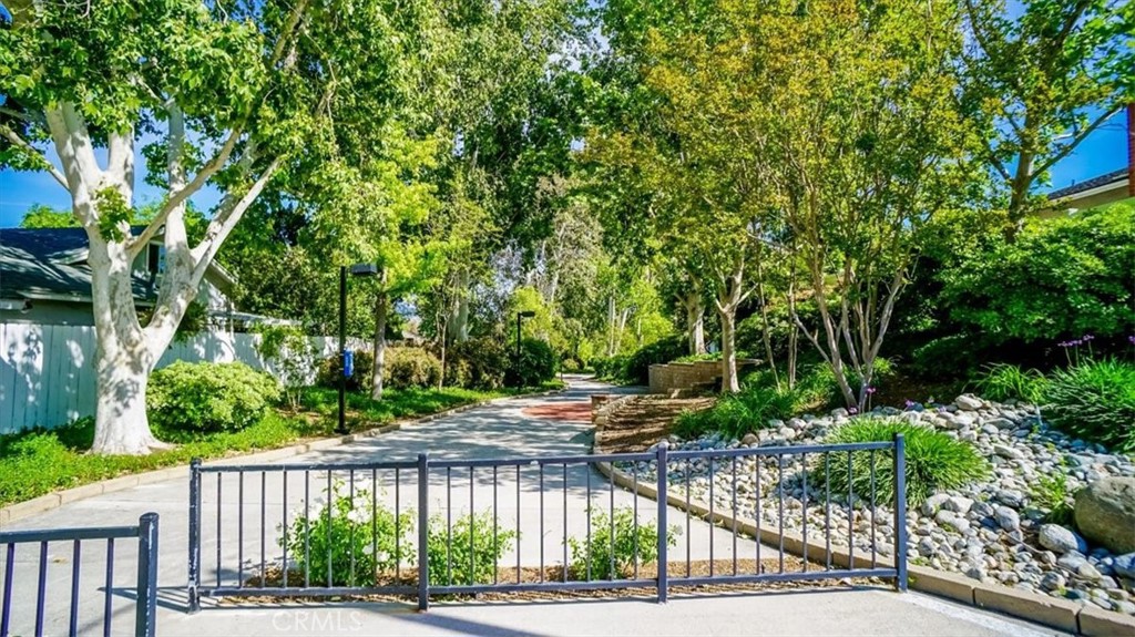 25326 Avenida Cappela Valencia, CA 91355 - Photo 43 of 48 a view of street with a small yard