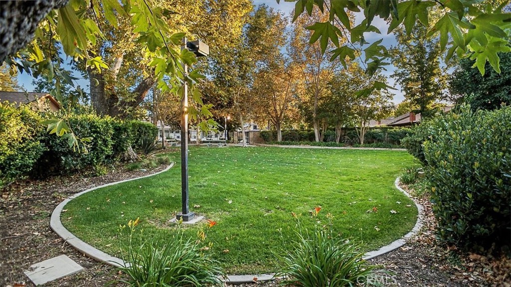 25326 Avenida Cappela Valencia, CA 91355 - Photo 44 of 48 a view of a garden with a fountain