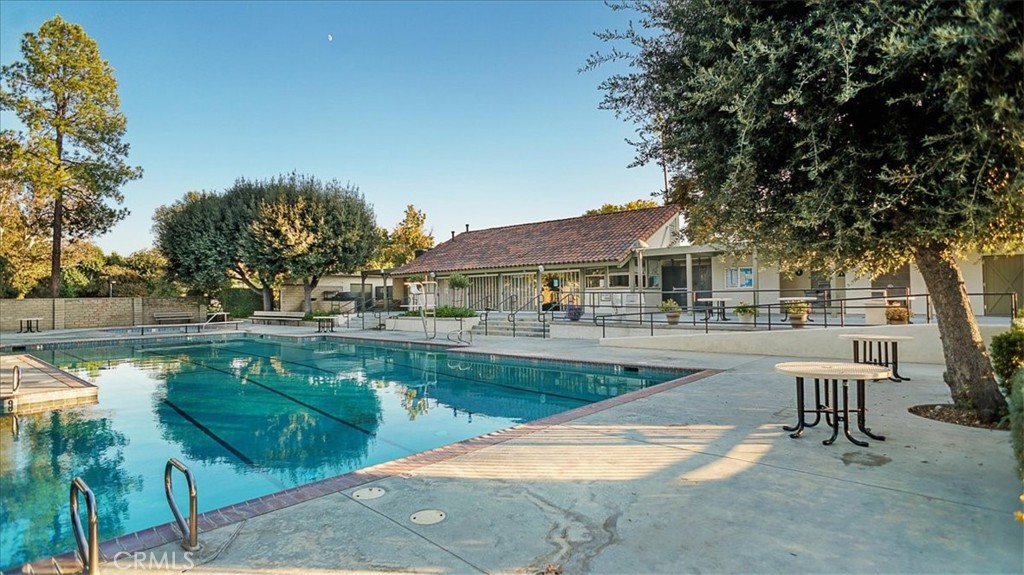 25326 Avenida Cappela Valencia, CA 91355 - Photo 45 of 48 a view of a swimming pool with a patio and a yard