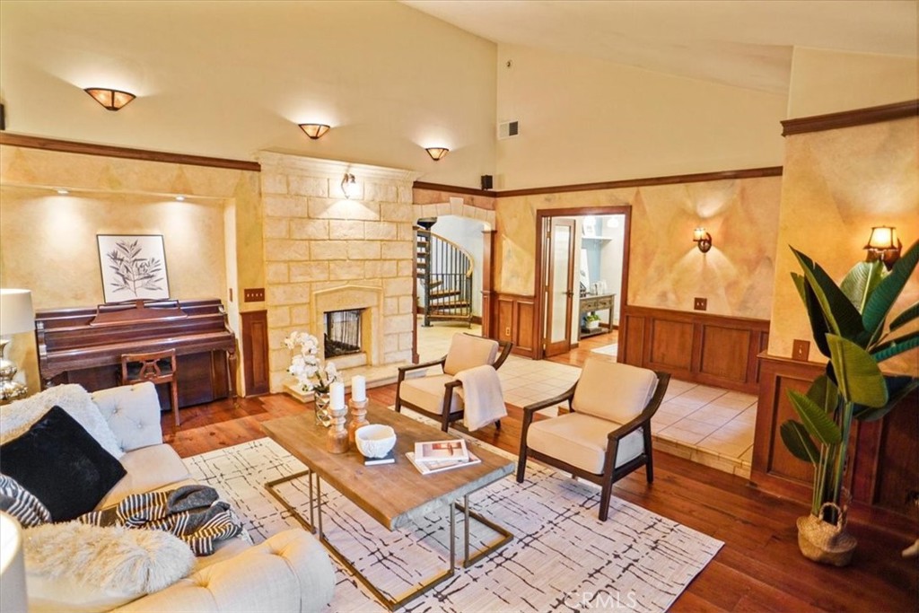 25326 Avenida Cappela Valencia, CA 91355 - Photo 5 of 48 a living room with furniture and wooden floor