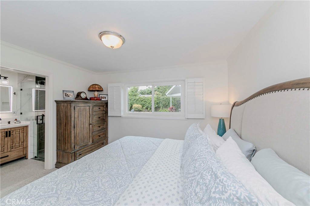 10252 Lorraine Lane Cypress, CA 90630 - Photo 27 of 44 a bedroom with furniture and window
