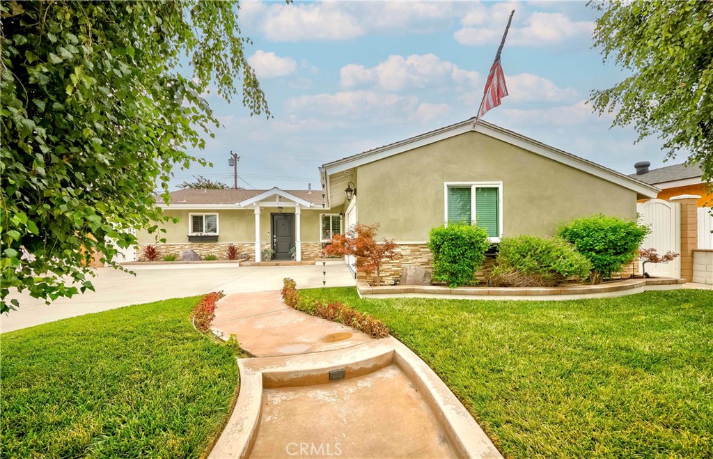 10252 Lorraine Lane Cypress, CA 90630 - Photo 3 of 44 a front view of a house with a yard