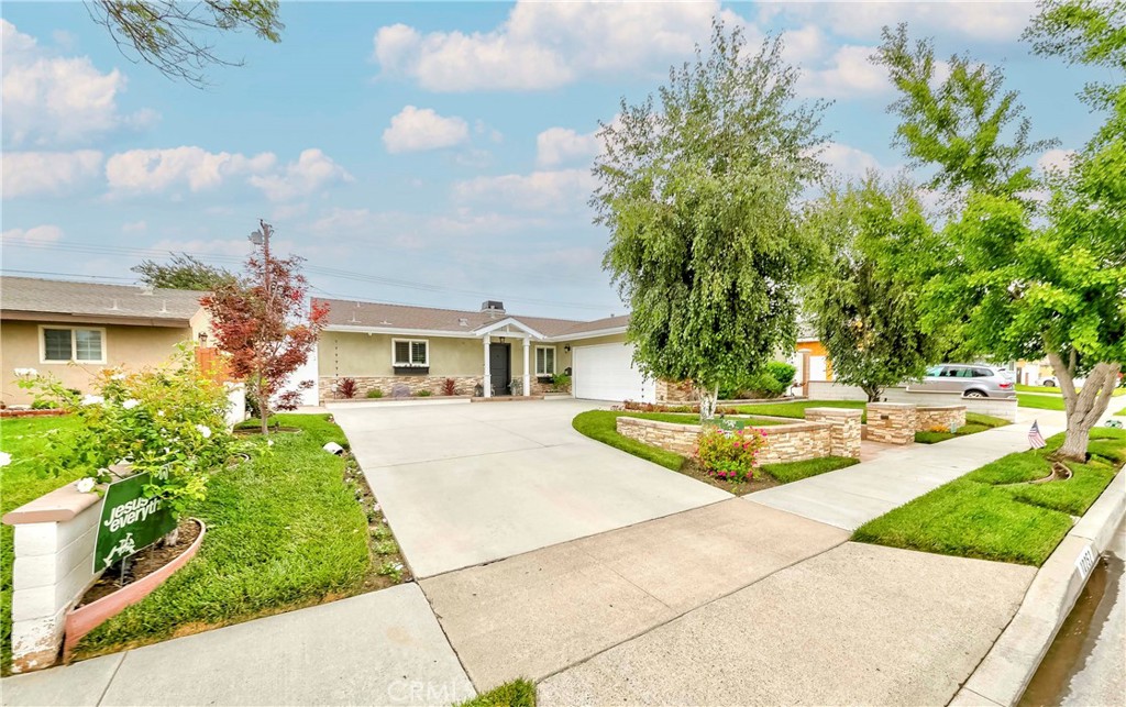 10252 Lorraine Lane Cypress, CA 90630 - Photo 5 of 44 a front view of a house with garden