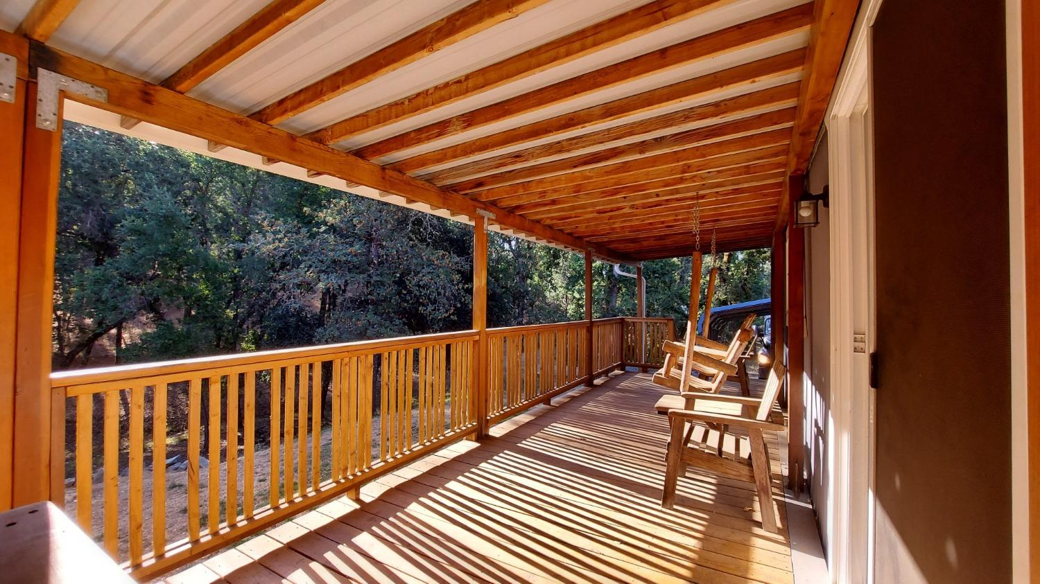 a view of balcony with wooden floor and outdoor space