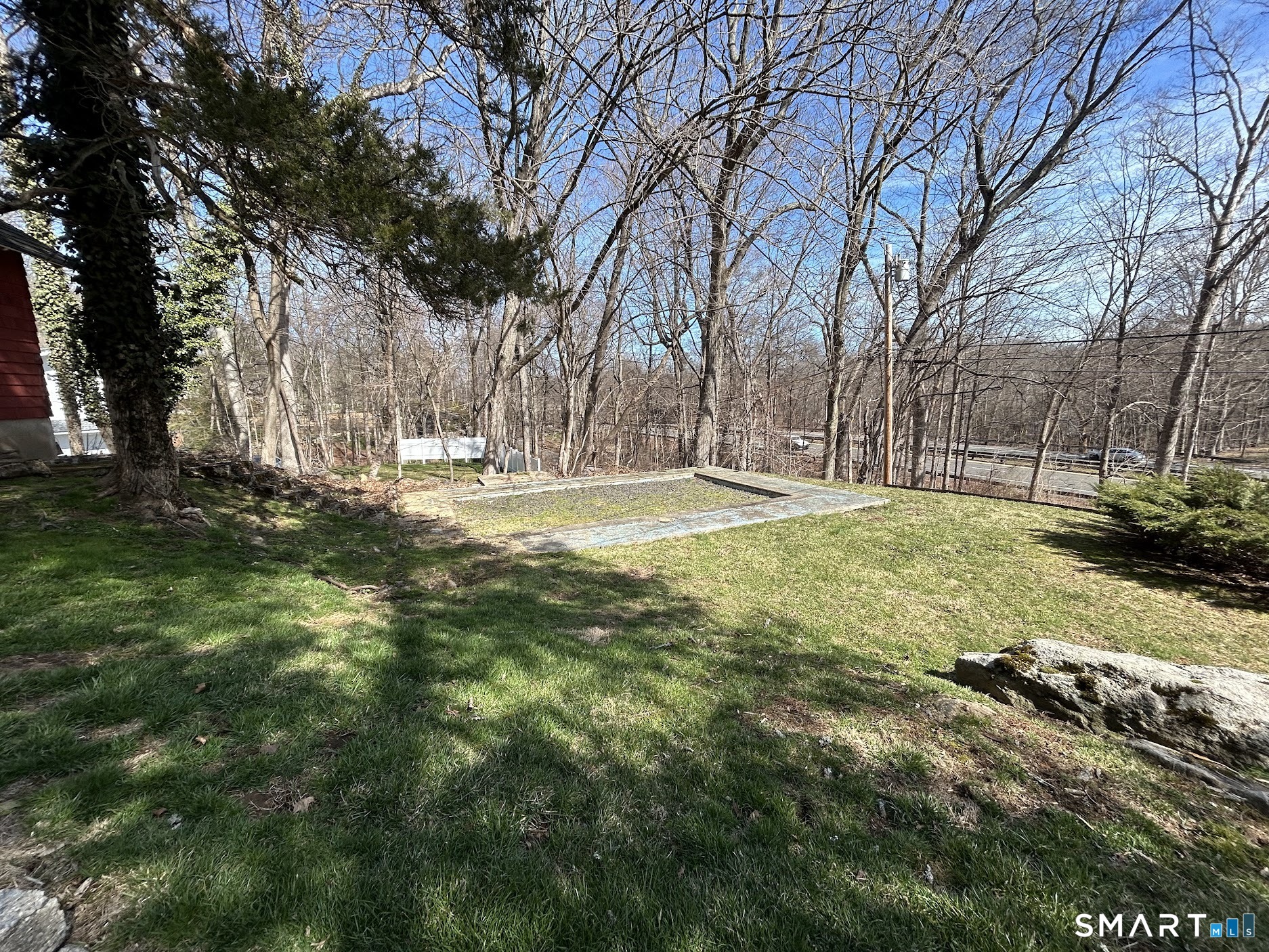236 Wire Mill Road Stamford, CT 06903 - Photo 8 of 11 a view of a yard with a tree