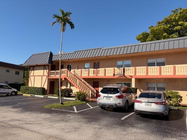 9374 Southwest 3rd Street, Unit 714 Boca Raton, FL 33428 - Photo 21 of 21 a car parked in front of a building