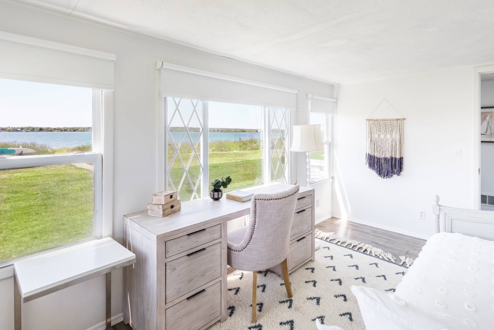 351 East Lake Drive Montauk, NY 11954 - Photo 14 of 30 a room with a bed a rug and a large window