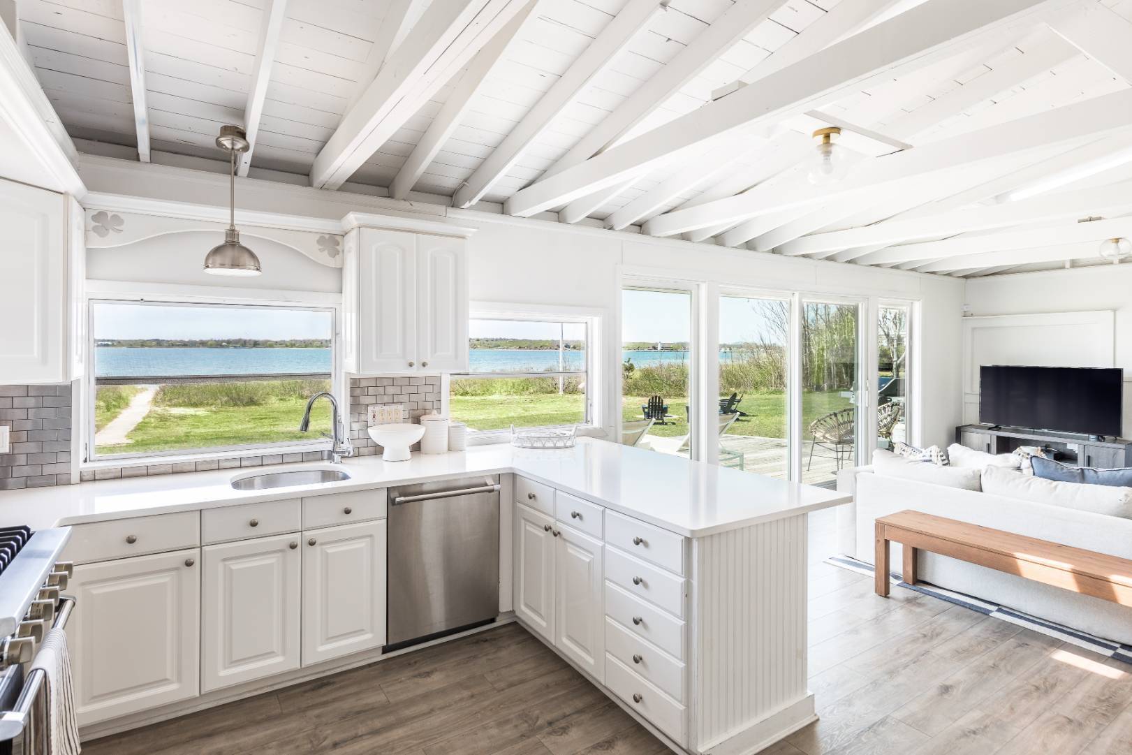351 East Lake Drive Montauk, NY 11954 - Photo 7 of 30 a large white kitchen with a large window