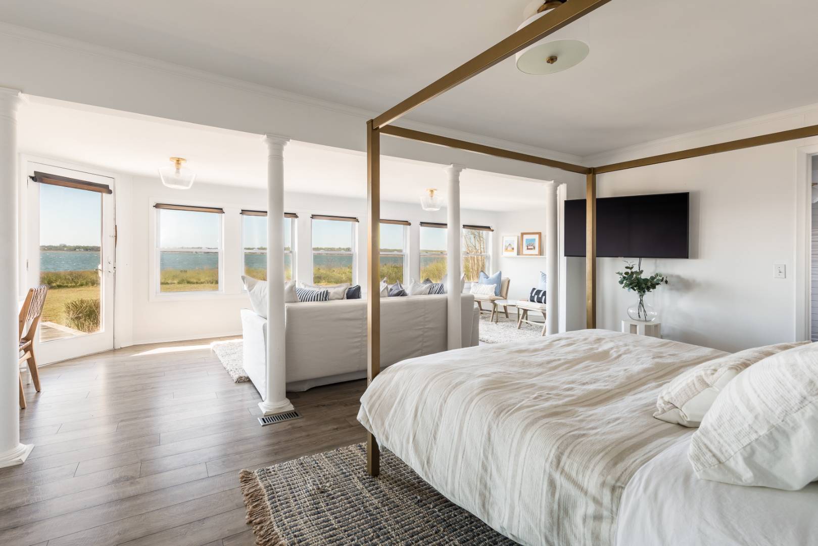 351 East Lake Drive Montauk, NY 11954 - Photo 9 of 30 a bedroom with a large bed and a large window