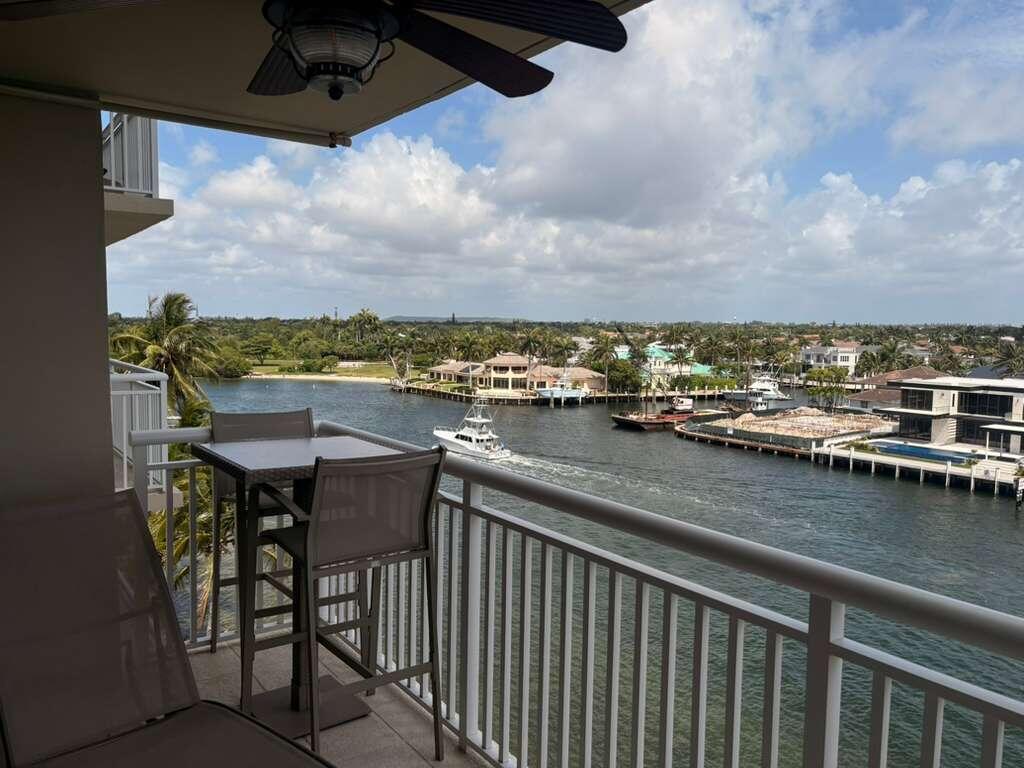 2611 North Riverside Drive, Unit 703 Pompano Beach, FL 33062 - Photo 5 of 81 a view of a chairs and table in the balcony
