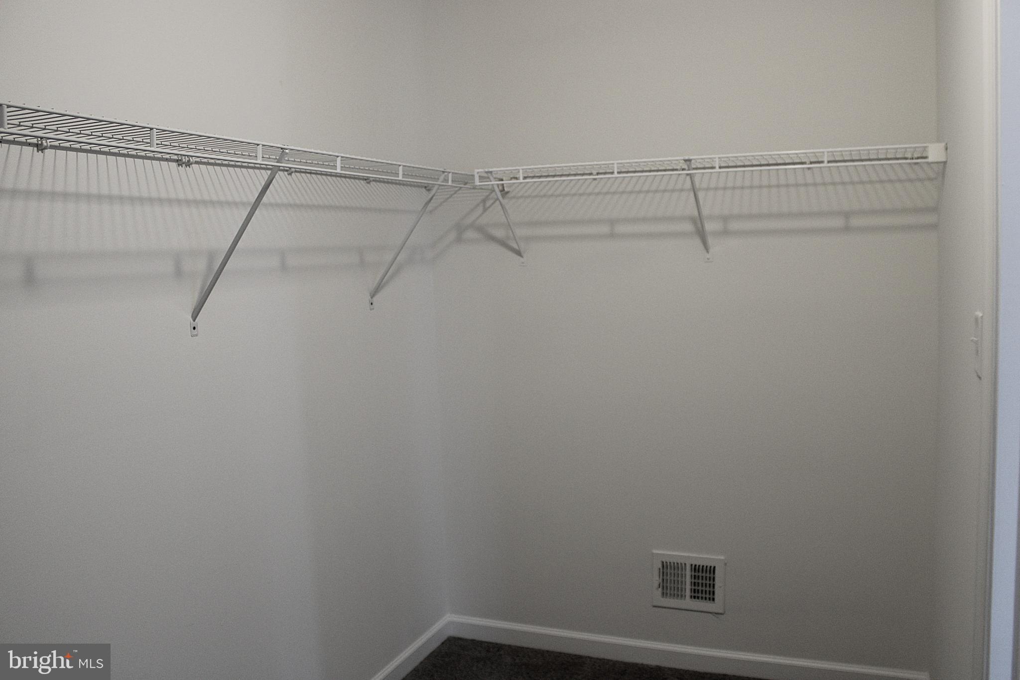 8 Cecily Way Ranson, WV 25438 - Photo 18 of 26 a view of a room with racks on the wall