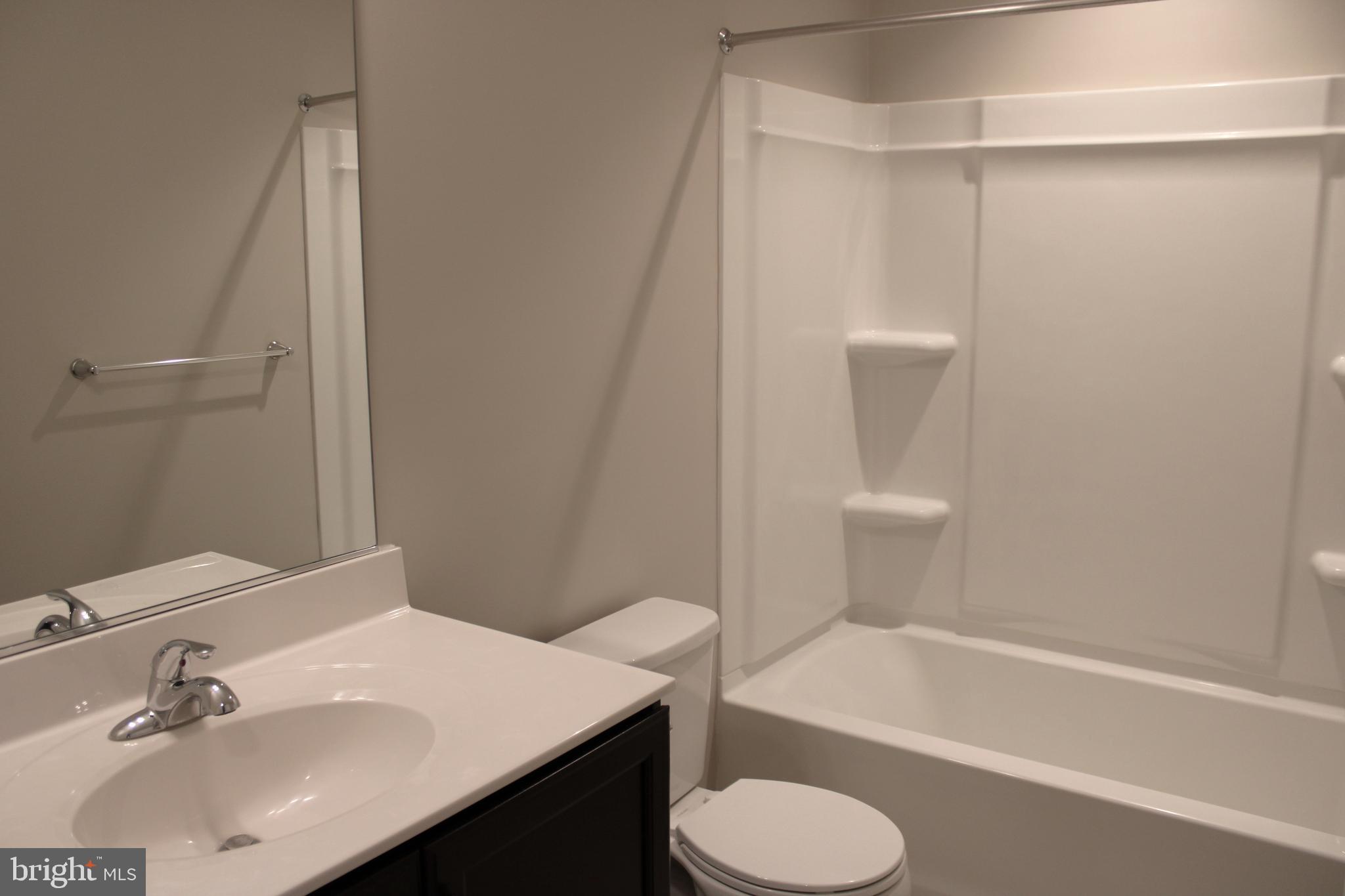 8 Cecily Way Ranson, WV 25438 - Photo 24 of 26 a bathroom with a sink toilet and shower
