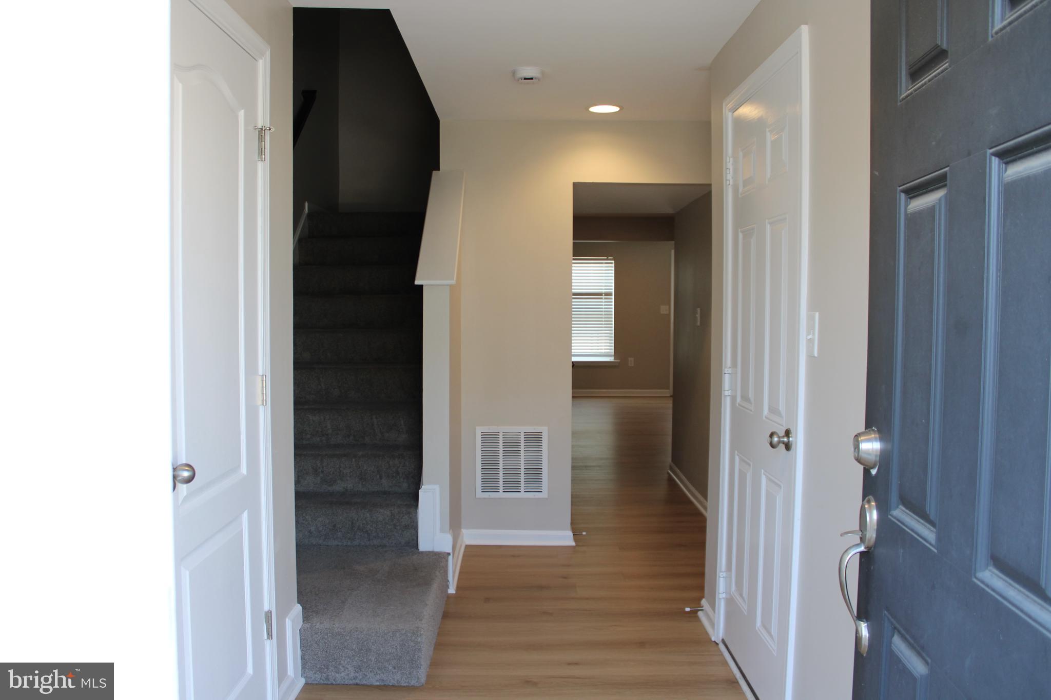 8 Cecily Way Ranson, WV 25438 - Photo 3 of 26 a view of a hallway with wooden floor
