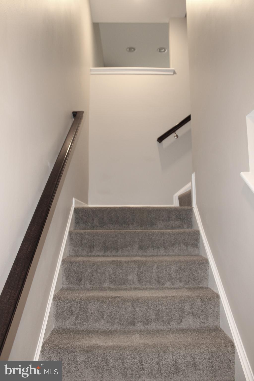 8 Cecily Way Ranson, WV 25438 - Photo 10 of 26 a view of staircase with white walls
