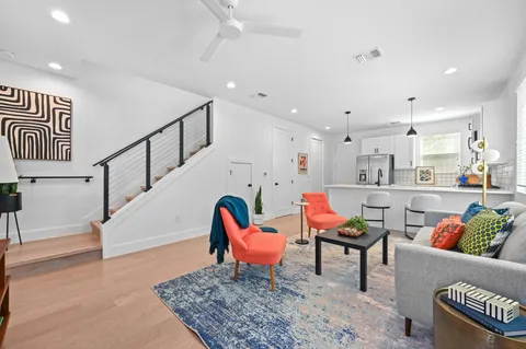 a living room with furniture and a rug