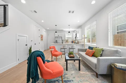 a living room with furniture and a table